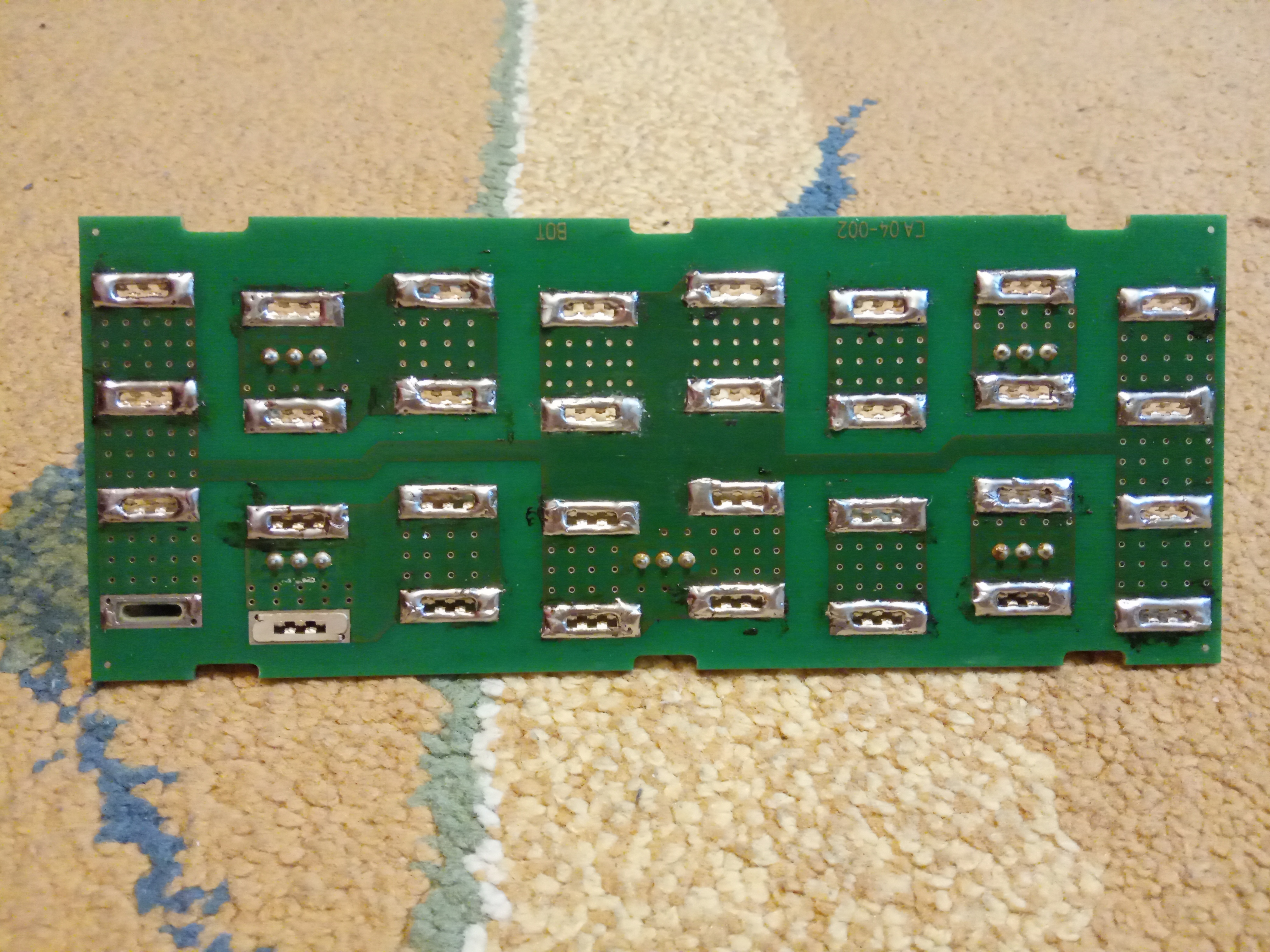 The PCB with terminals soldered to it.